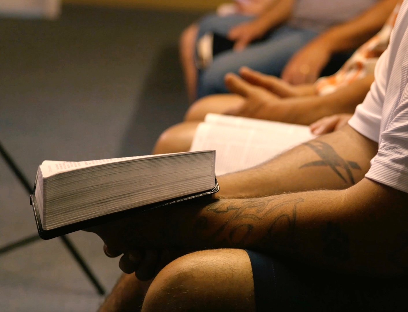 Church community members reading the Bible together